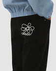 Pantalon à poches brodées